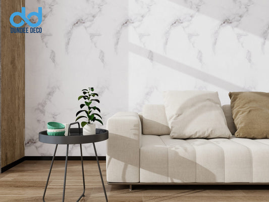 Living area with couch against marble wall