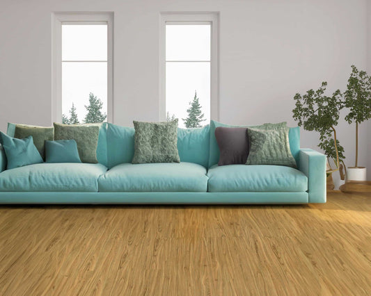 Relaxing space with a blue couch and green pillows.