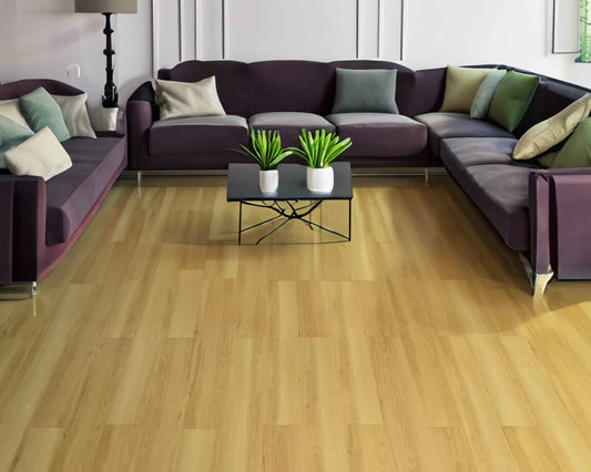 A cozy living room with wooden floors and stylish purple couches. Perfect for relaxing and unwinding.