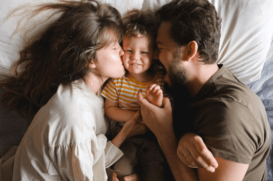 family spending time together in bed