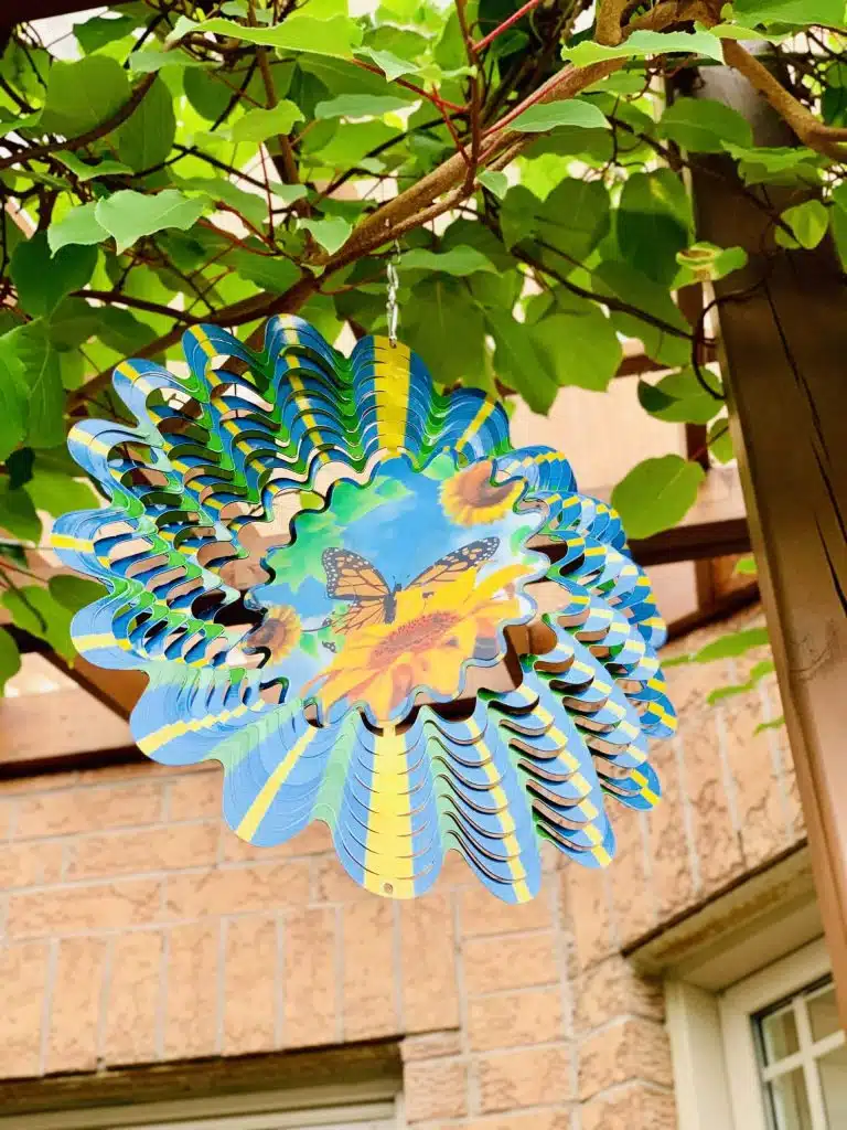  Blue and yellow wind spinner with butterfly design