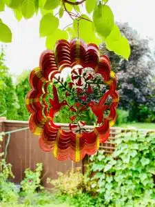 Red wind spinner with two hummingbirds design