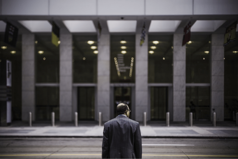 man crossing street in toronto financial district