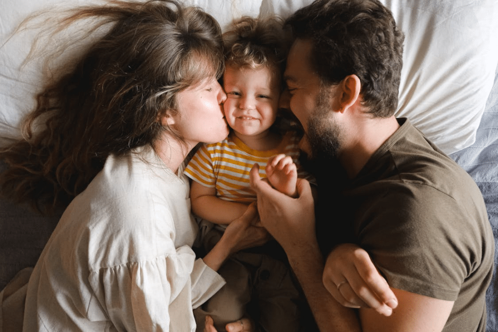 family spending time together in bed