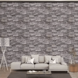 couch with decorative wall in the background